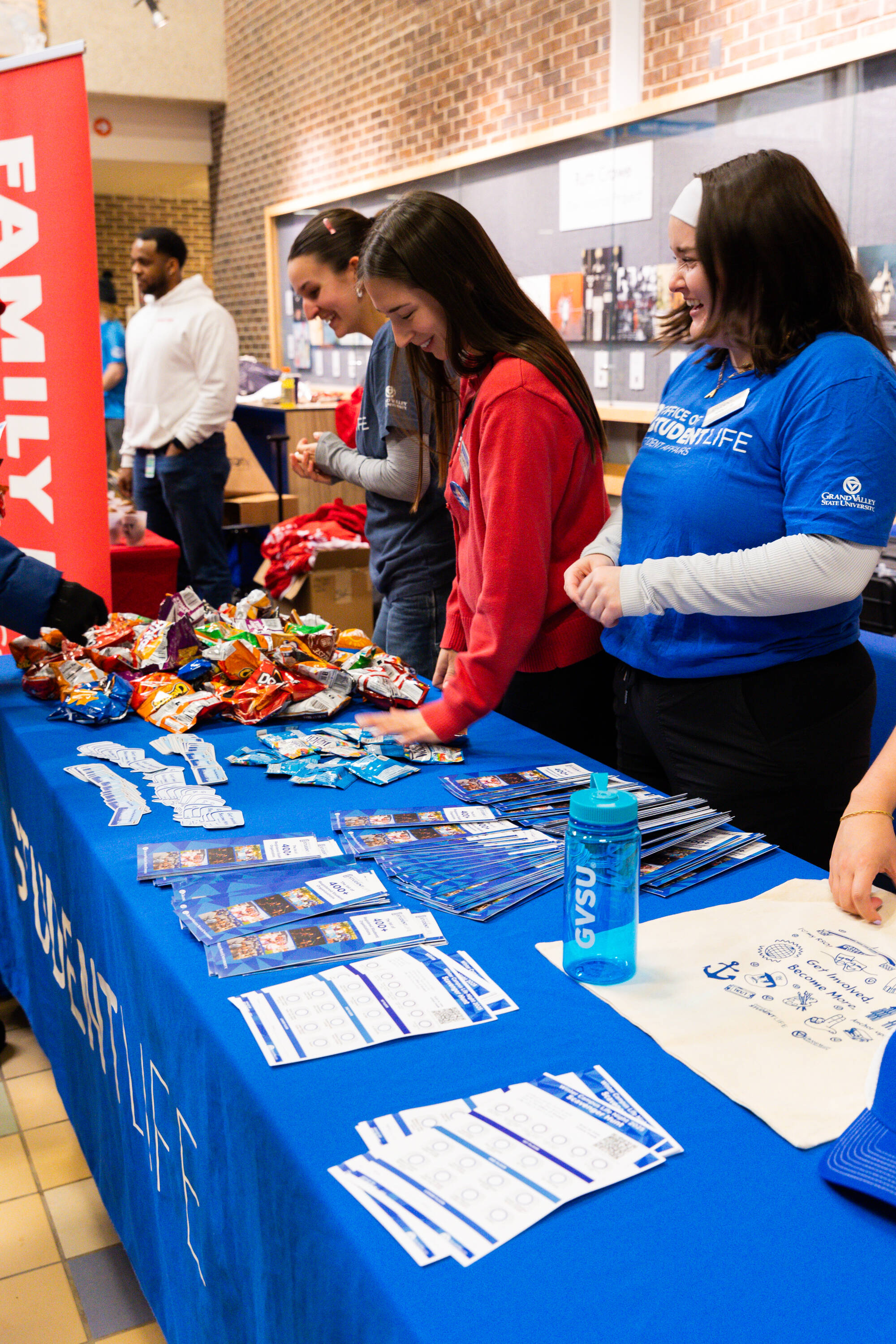 A student prepares snacks to give to students.